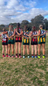 Red armband protest reaches Mooroolbark in calls to reverse cuts to gender equity in sport