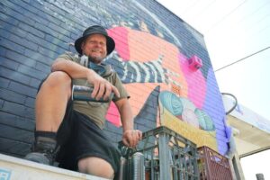 Buzzart’s beautiful mural tackles tagging issue in Wandin